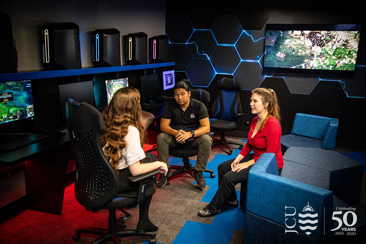 3 students chatting in the  eSports room