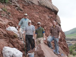 Researchers Prof. Robert Reisz, unknown field assistant, Dr. David Evans, A.Prof Eric Roberts () at the excavation site in South Africa