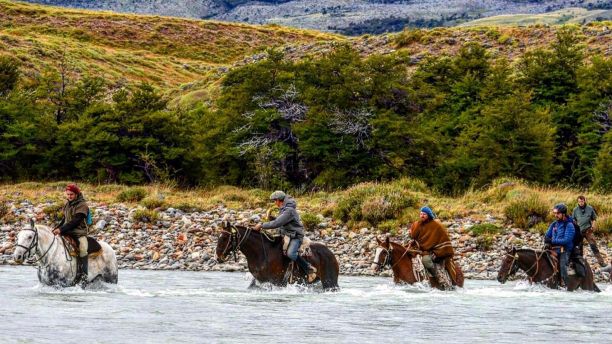 	Dr Campbell Costello riding a horse across Patagonia for the Gaucho Derby.